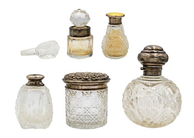 Lot 152 - A selection of five silver-mounted cut glass dressing table bottles.