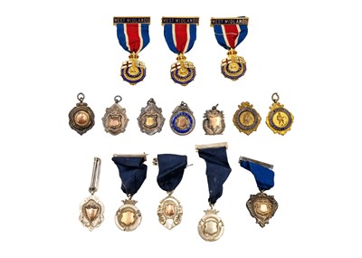 Lot 216 - A collection of twelve hallmarked silver medallions with ribbons.