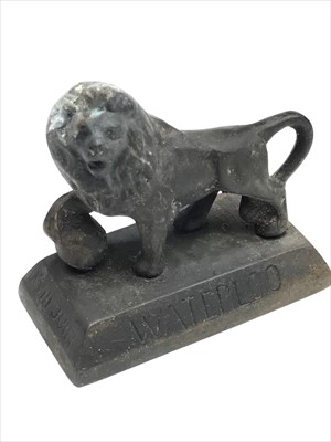 Lot 59 - A small cast metal Lion of Waterloo ornament,...