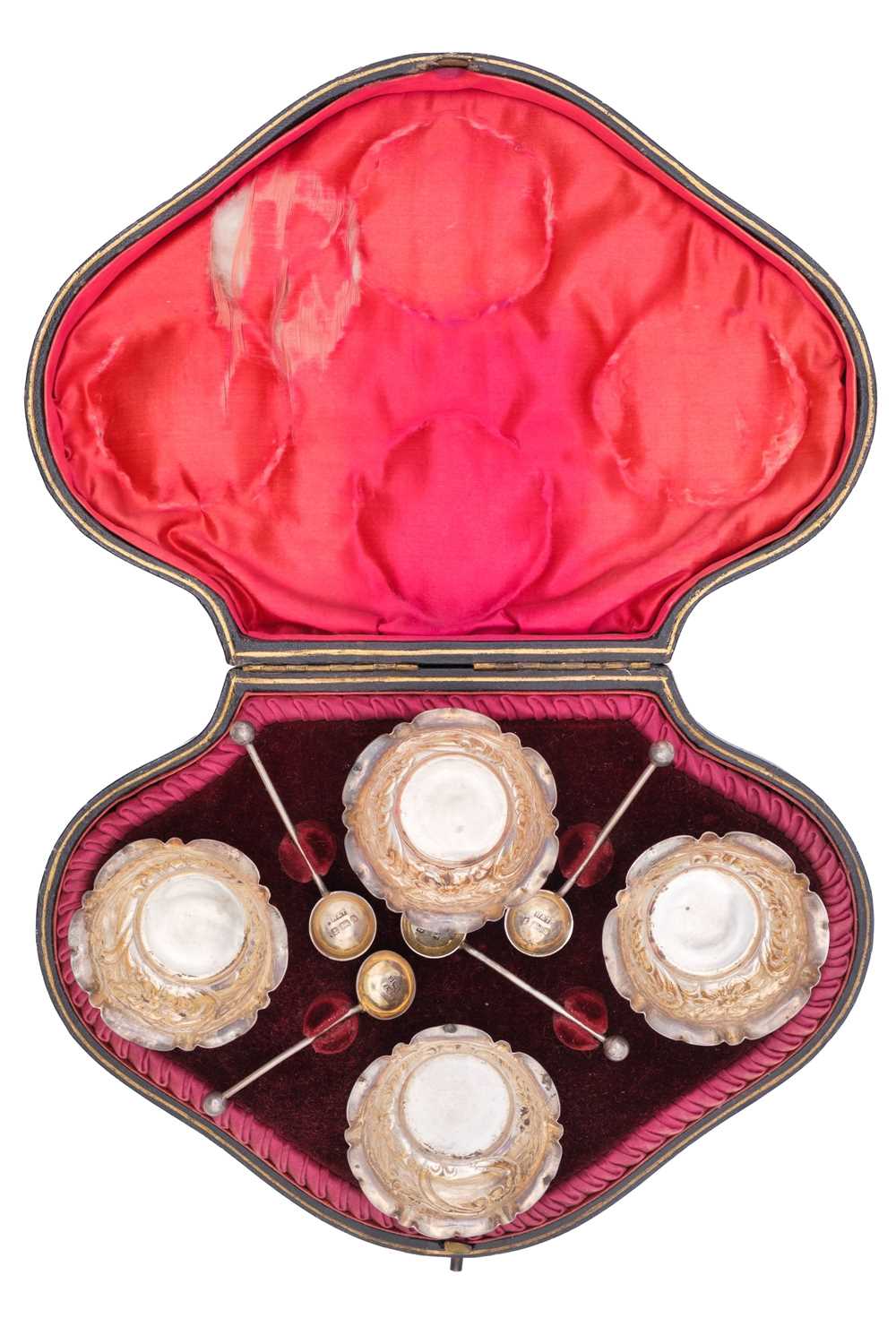 Lot 26 - A Victorian silver set of four salts and spoons within original fitted case by Hilliard & Thomason.