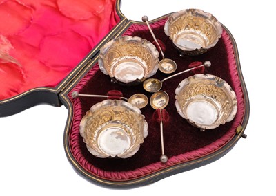 Lot 26 - A Victorian silver set of four salts and spoons within original fitted case by Hilliard & Thomason.