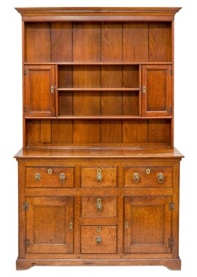 Lot 1163 - A George III style oak dresser.