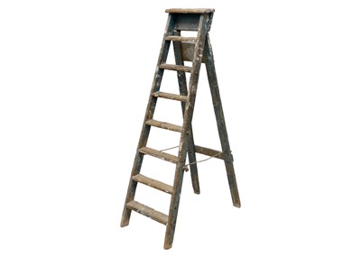 Lot 1403 - A set of seven tread wood ladders painted blue.