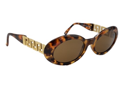 Lot 330 - A pair of Versace tortoiseshell effect sunglasses.