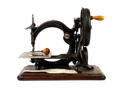 Lot 24 - A Willcox & Gibbs sewing machine.