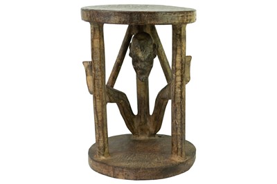 Lot 98 - A Bamileke wood carved figural stool.