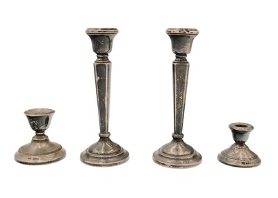 Lot 176 - A pair of modern silver candlesticks.