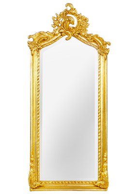 Lot 243 - A gilt composition wall mirror, 20th century.