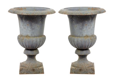 Lot 127 - A pair of cast iron campana shaped garden urns, 20th century.