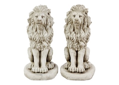 Lot 125 - A pair of reconstituted stone garden ornaments in the form of lions.