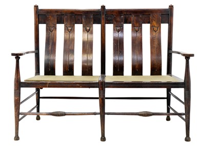 Lot 1557 - An Arts and Crafts oak settle by William Birch.