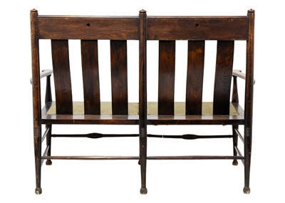 Lot 1557 - An Arts and Crafts oak settle by William Birch.