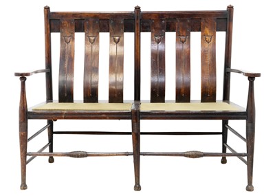 Lot 1557 - An Arts and Crafts oak settle by William Birch.
