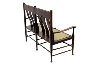 Lot 1557 - An Arts and Crafts oak settle by William Birch.