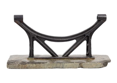 Lot 124 - A black painted cast iron boot scraper. on a slate plinth.