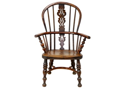 Lot 1094 - A 19th century ash and elm child's Windsor armchair.