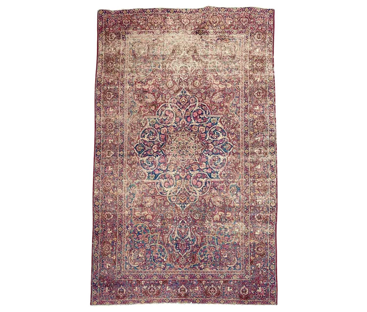 Lot 601 - An antique Persian Kerman rug.