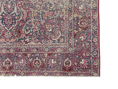 Lot 601 - An antique Persian Kerman rug.