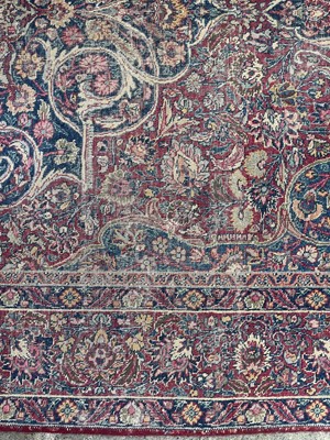 Lot 601 - An antique Persian Kerman rug.