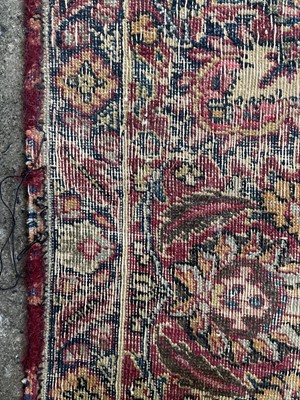 Lot 601 - An antique Persian Kerman rug.