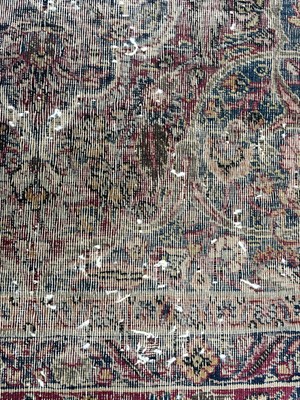 Lot 601 - An antique Persian Kerman rug.