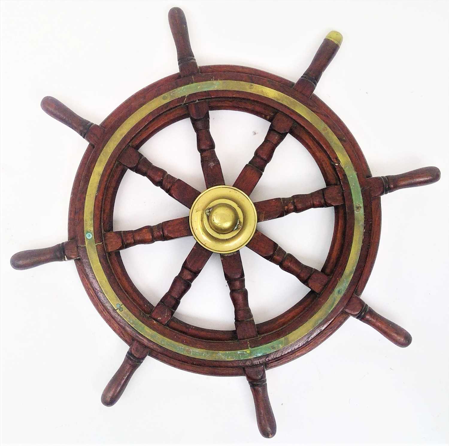 Lot 123 - A wooden ship's wheel, diameter 75cm, together...