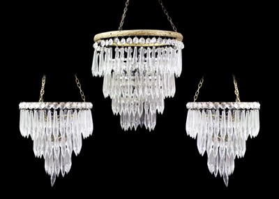 Lot 330 - A brass and chrome mounted cut glass chandelier.