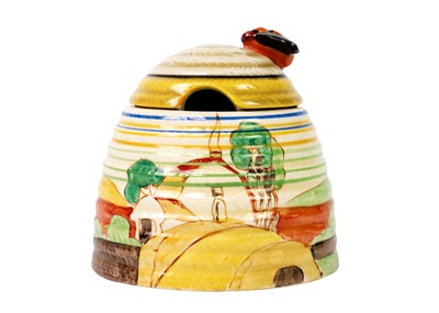 Lot 207 - An unusual Clarice Cliff Orange Cottage Roof pattern beehive honeypot.