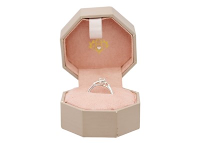 Lot 48 - A 9ct white gold diamond solitaire ring by Emmy of London.
