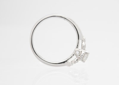 Lot 48 - A 9ct white gold diamond solitaire ring by Emmy of London.