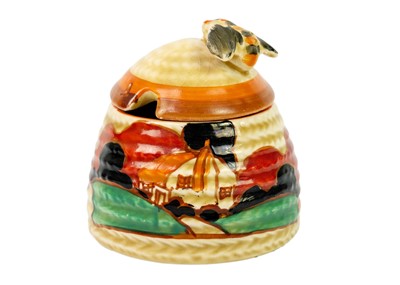 Lot 188 - A small Clarice Cliff Farmhouse pattern beehive honey pot.