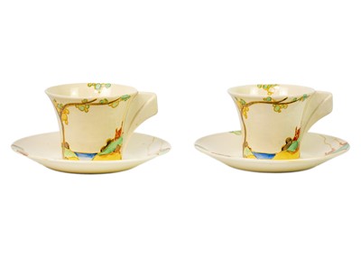 Lot 182 - A pair of Clarice Cliff Secrets pattern Daffodil shape tea cups and saucers.