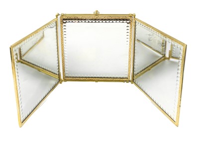 Lot 1616 - A brass folding triptych mirror.