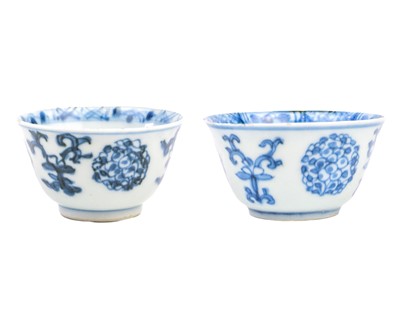 Lot 1098 - Two similar Chinese blue and white porcelain tea bowls, Kangxi period.