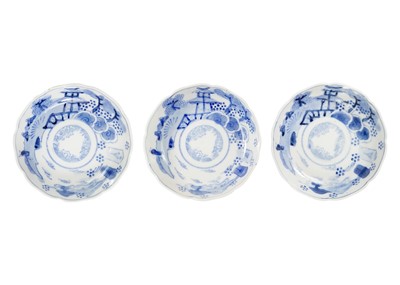 Lot 1101 - Three Japanese Arita blue and white shallow bowls.