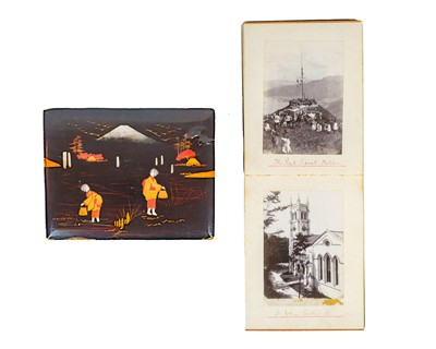 Lot 1104 - A black japanned photo album of twenty-six images of Hong Kong.