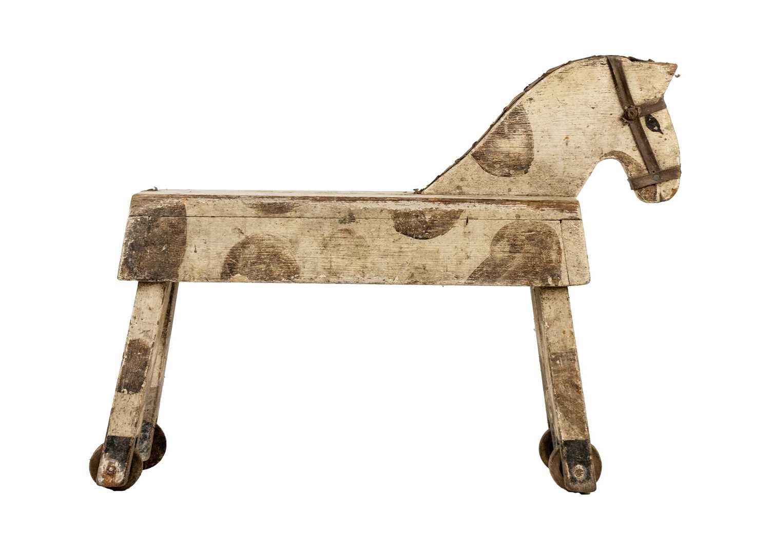 Lot 1297 - A folk art toy horse.