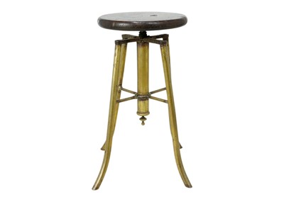 Lot 1664 - An early 20th century brass adjustable stool.