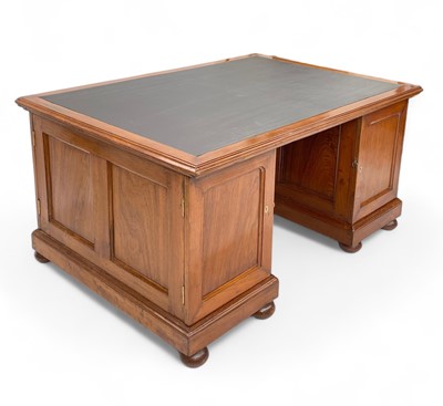 Lot 1672 - A teak twin pedestal partners desk.