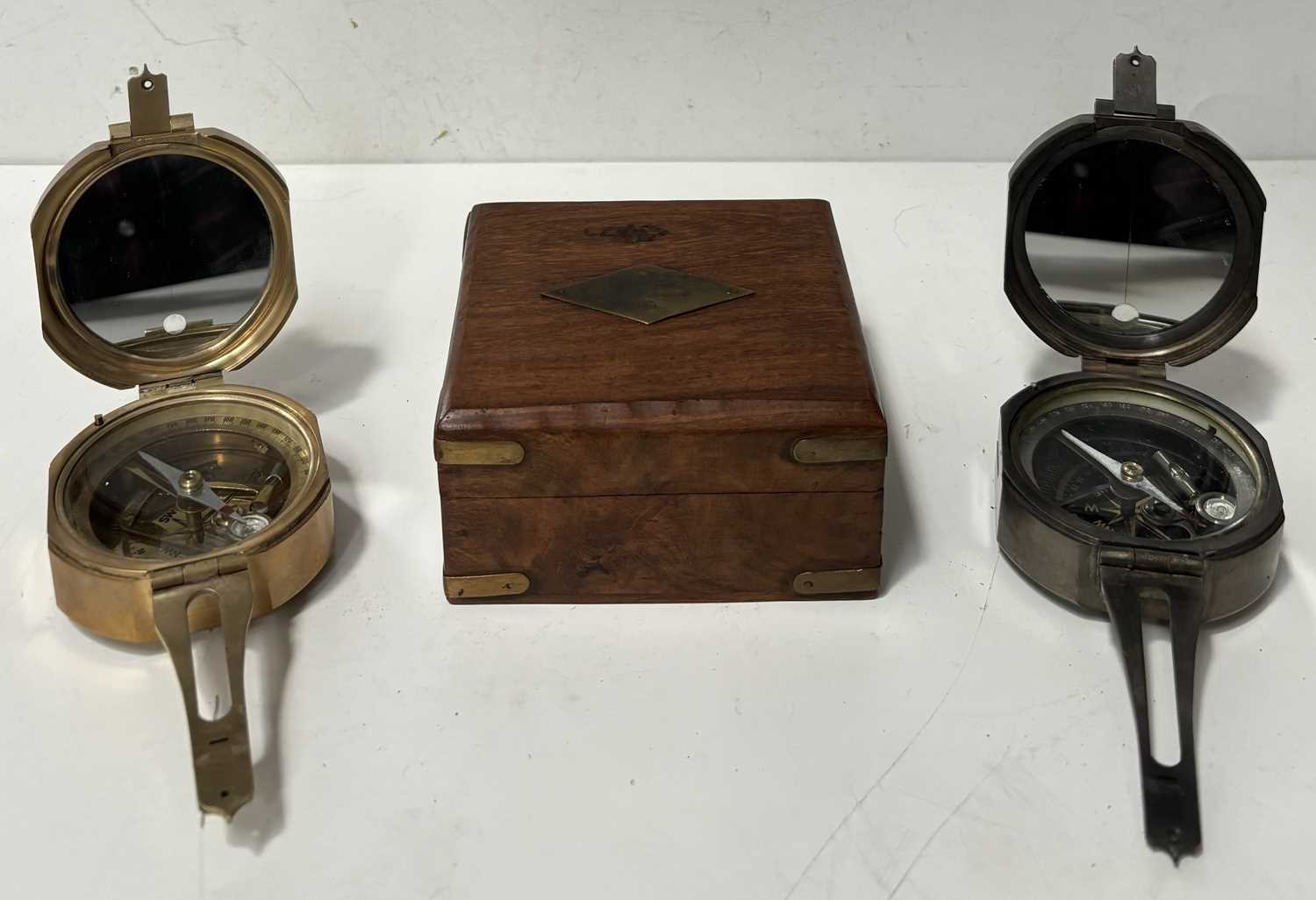 Lot 143 - A compass with wooden box, with one other