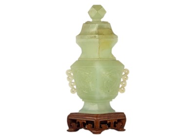 Lot 271 - A Chinese carved jade vase and cover