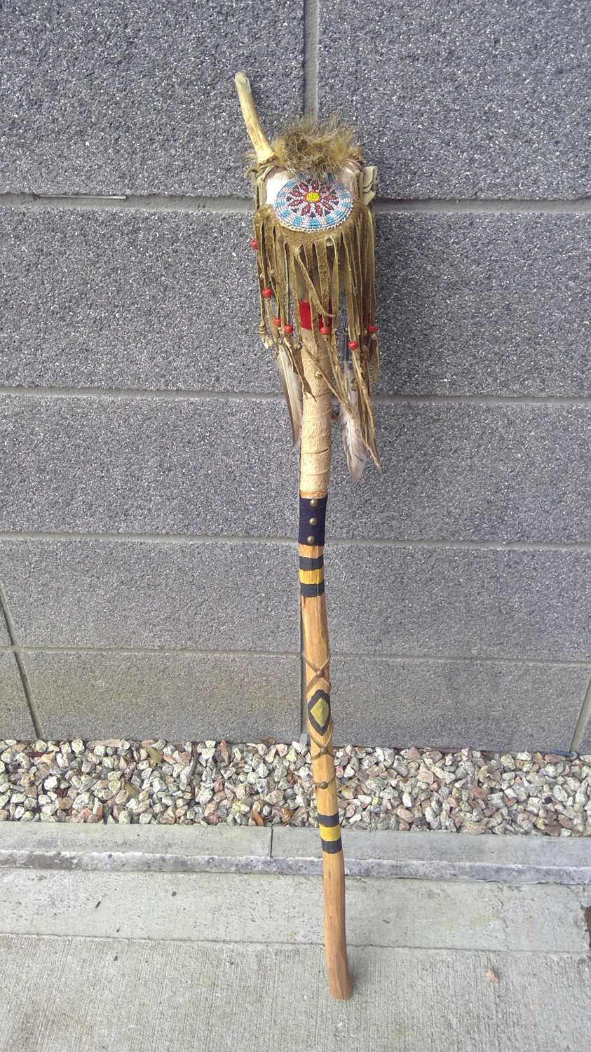 Native Rope Sticks Lot 203 - A Native American Stick. The Stick is 105cm