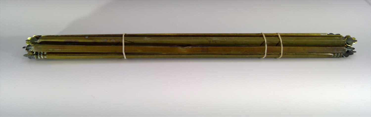 Lot 33 - A set of 14 brass stair rods. Width 68cm.