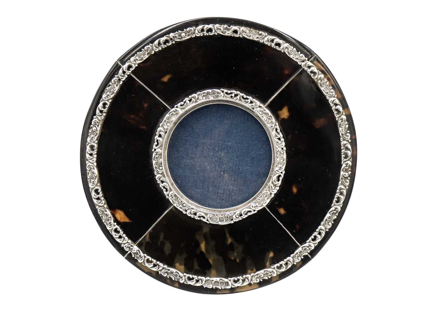 Lot 209 - A Victorian attractive and unusual silver-mounted tortoiseshell circular photograph frame by J Batson & Son.