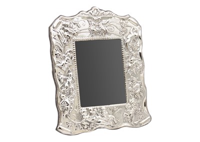 Lot 203 - A modern silver embossed rectangular photograph frame.