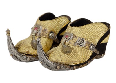 Lot 283 - A pair of Middle Eastern velvet and metal shoes, 20th century.