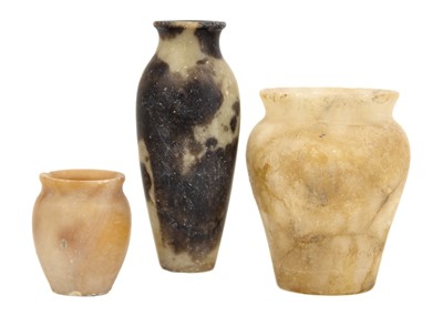 Lot 1119 - Three Egyptian alabaster vases.