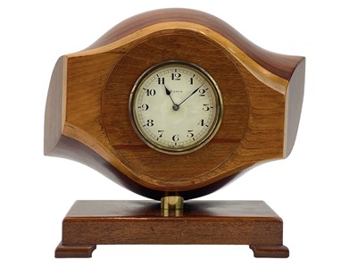 Lot 532 - A laminated wooden propeller mantle clock.