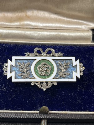 Lot 8 - CARTIER - An exquisite Belle Epoque gold, diamond and guilloche enamel panel brooch.