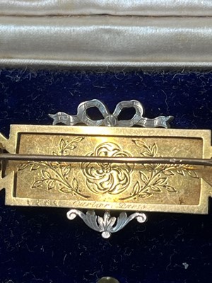 Lot 8 - CARTIER - An exquisite Belle Epoque gold, diamond and guilloche enamel panel brooch.